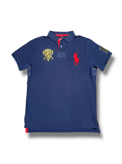 XTENDED Vintage Ralph Lauren navy blue cotton polo shirt with red embroidered logo and crest detail.