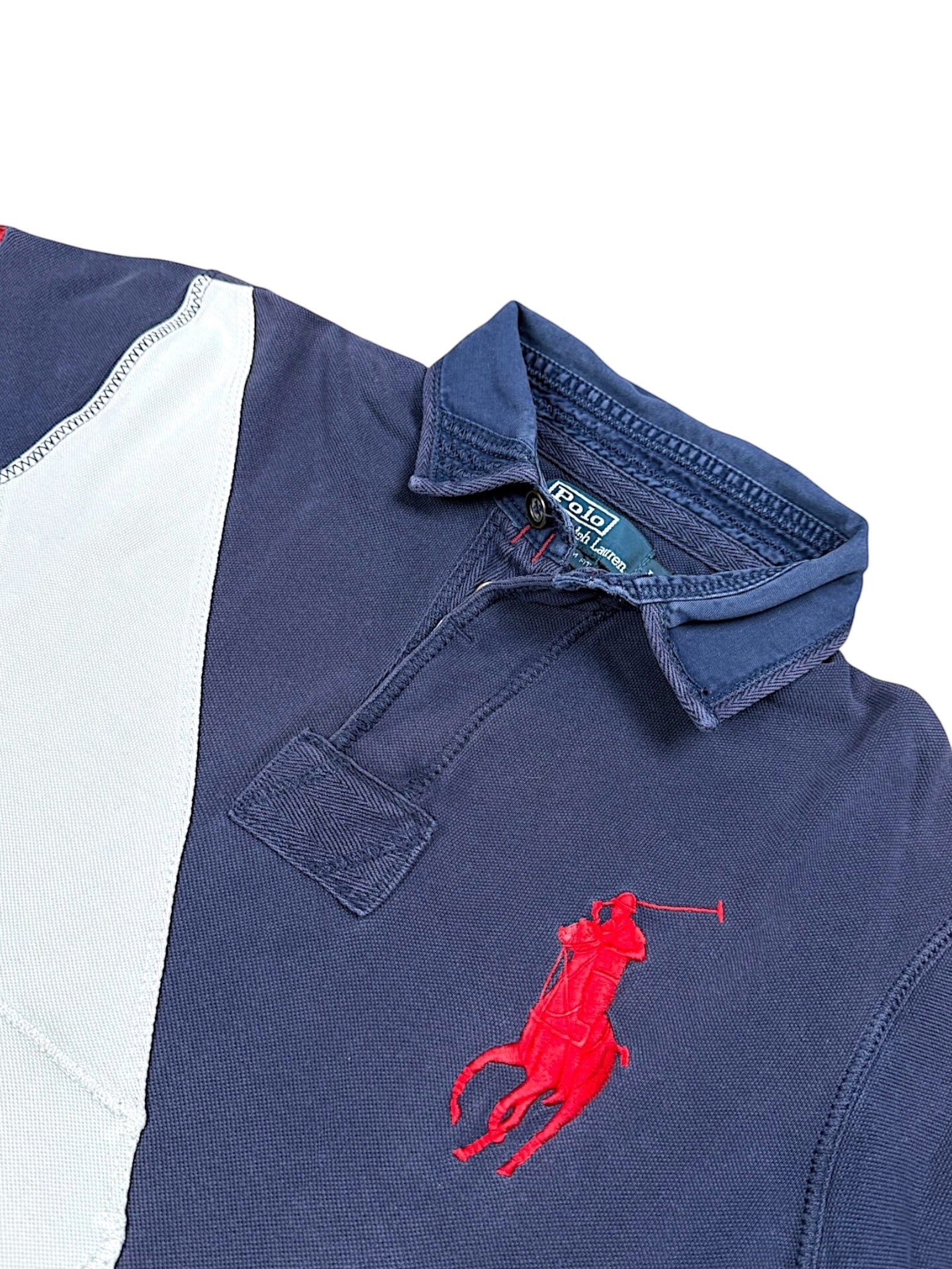 XTENDED Ralph Lauren navy blue polo shirt with red embroidered pony logo and white panel detail.