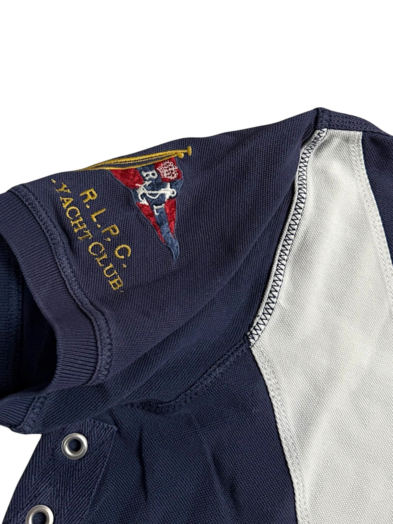 XTENDED Vintage Ralph Lauren navy blue polo shirt with R.L.P.C. Yacht Club embroidery and grey paneling.