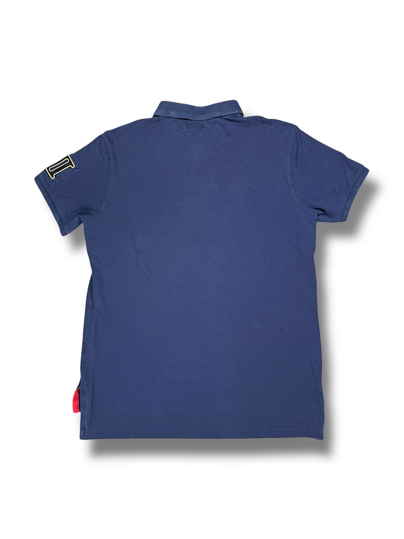XTENDED Vintage navy blue cotton polo shirt with embroidered yellow 'I' logo on left sleeve and red accent tag.