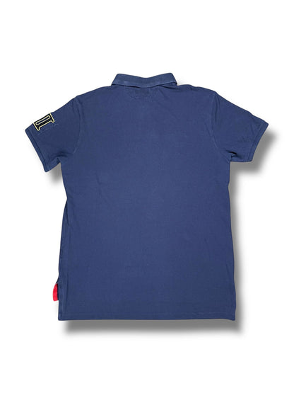 XTENDED Vintage navy blue cotton polo shirt with embroidered yellow 'I' logo on left sleeve and red accent tag.