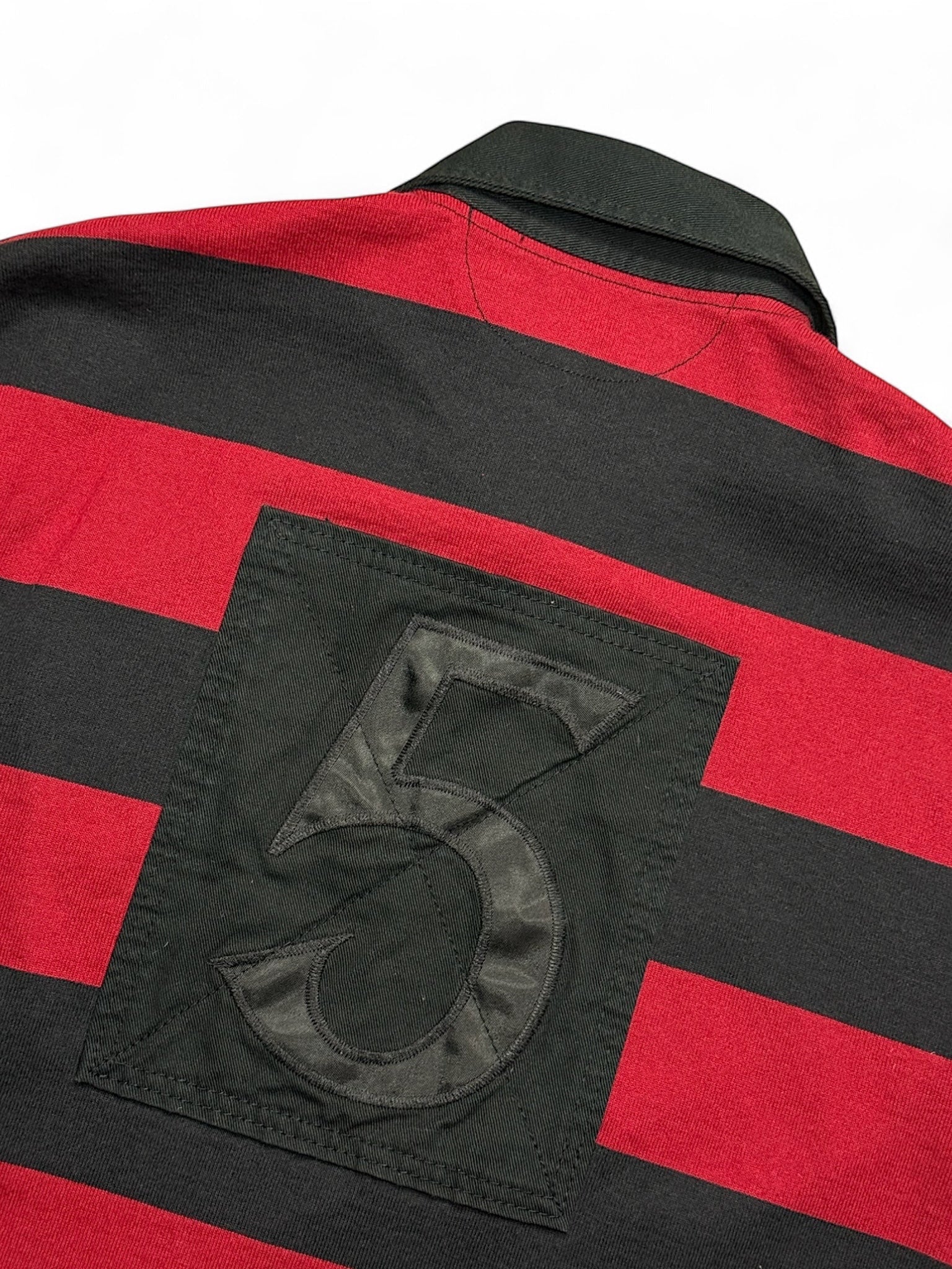 XTENDED vintage Ralph Lauren long sleeve polo shirt with red and black stripes and a black patch with a large number 5.