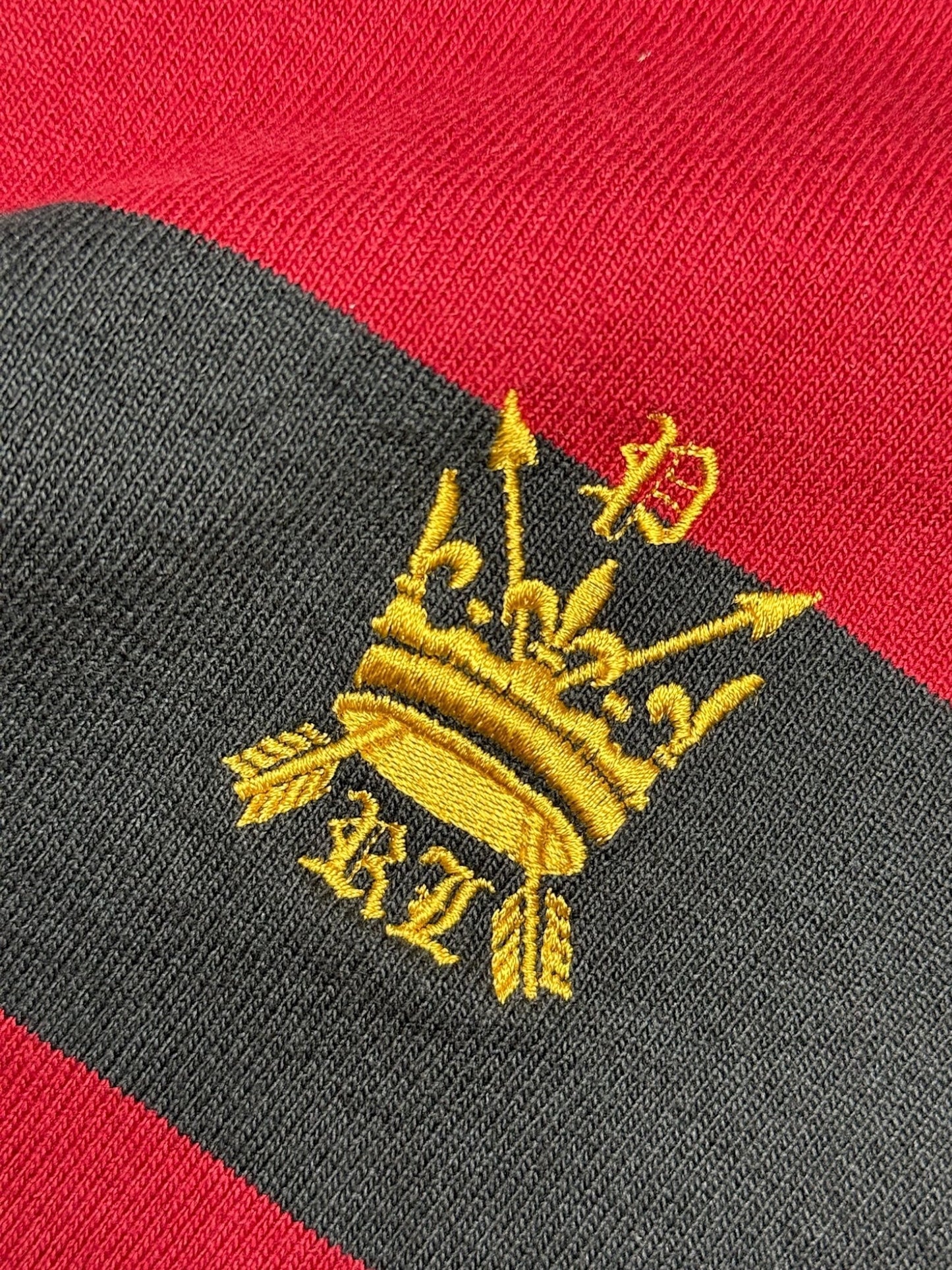 XTENDED vintage red and black striped long sleeve polo shirt with gold crown embroidery.